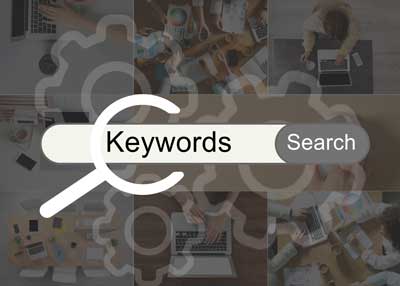 A search bar with the words Surrey SEO Agency and a magnifying glass icon overlays a collage of people working on laptops, tablets, and paperwork at desks. The word Search appears on the right side of the bar.